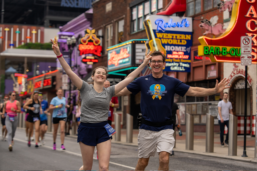 Two runners having fun at Broadway at Run Rock'n'Roll Nashville