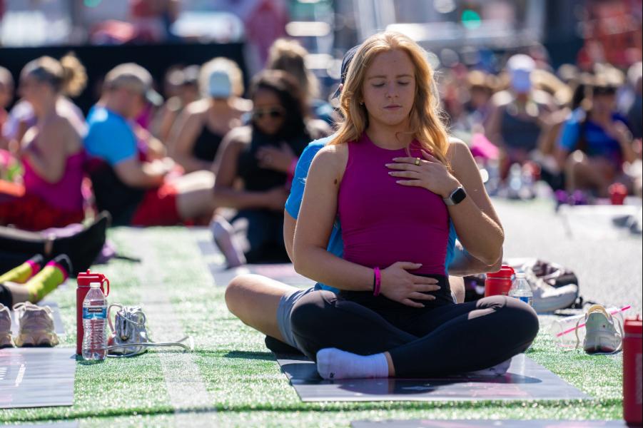 Athletes breathe deeply during Yoga in the Park