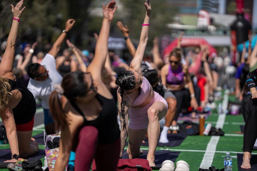 Athletes participate in Yoga in the Park
