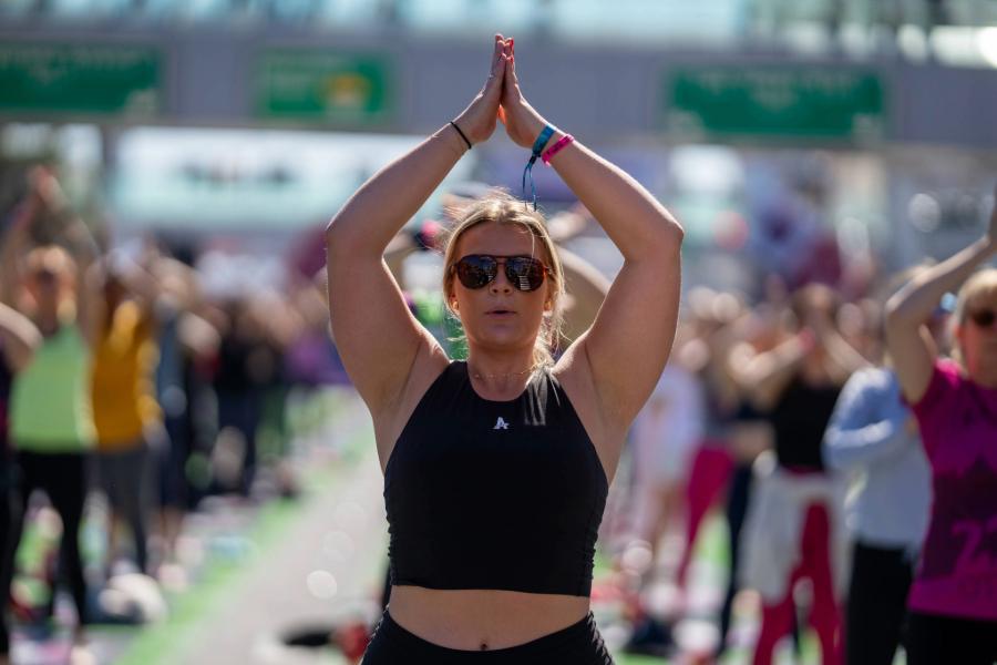 Athlete strikes a pose during Yoga in the Park